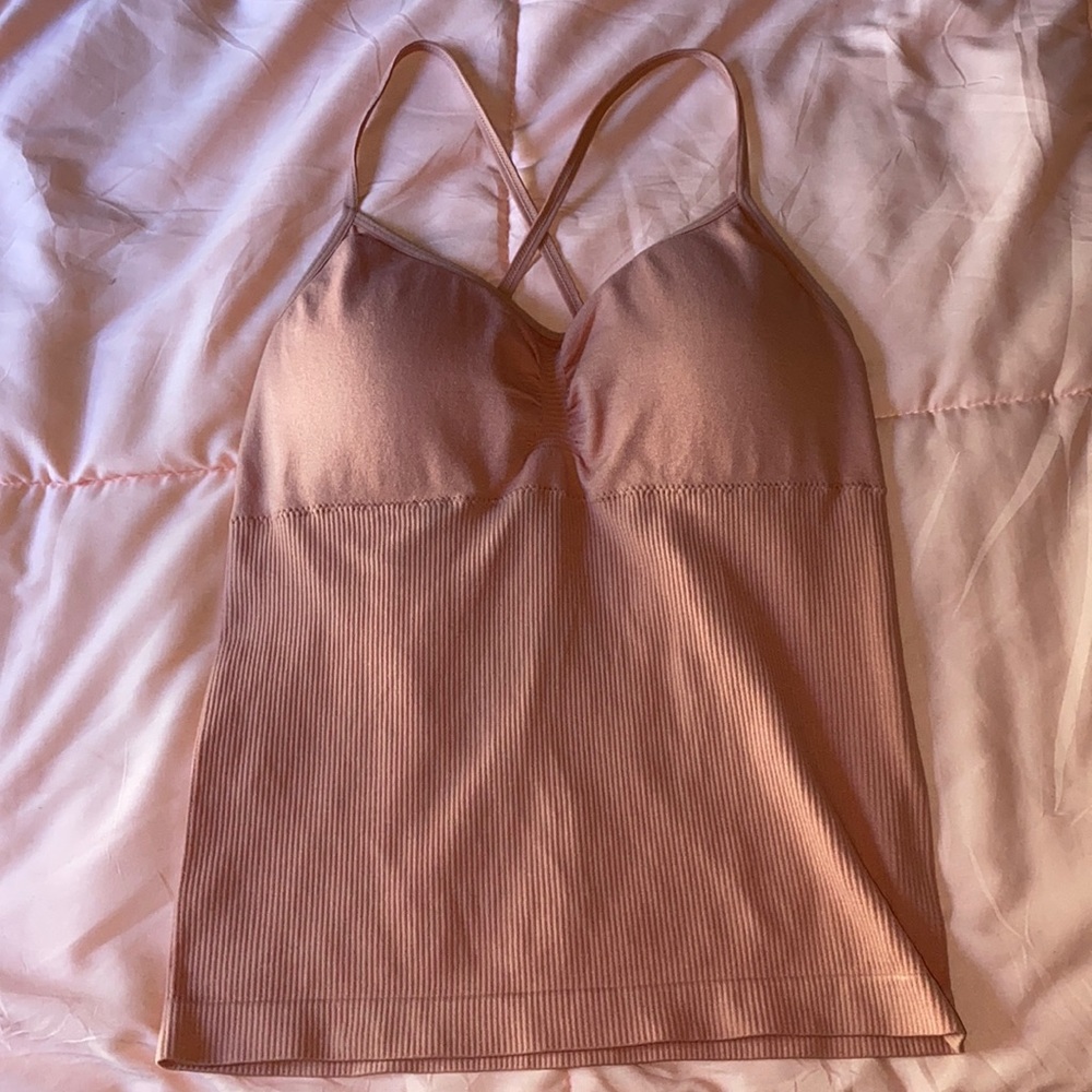 Women’s athletic tank top with built in bra and cross strings in the back